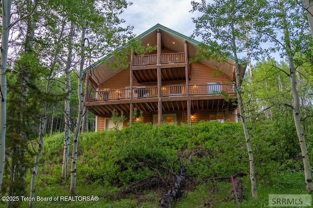 4770 Deer Dr, Island Park, ID 83429 - rear view of property featuring a wooden deck and log veneer siding