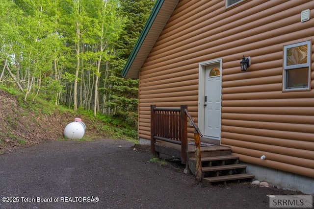 4770 Deer Dr, Island Park, ID 83429 - view of exterior entry with log veneer siding