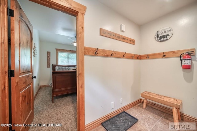 4770 Deer Dr, Island Park, ID 83429 - doorway with baseboards and a ceiling fan