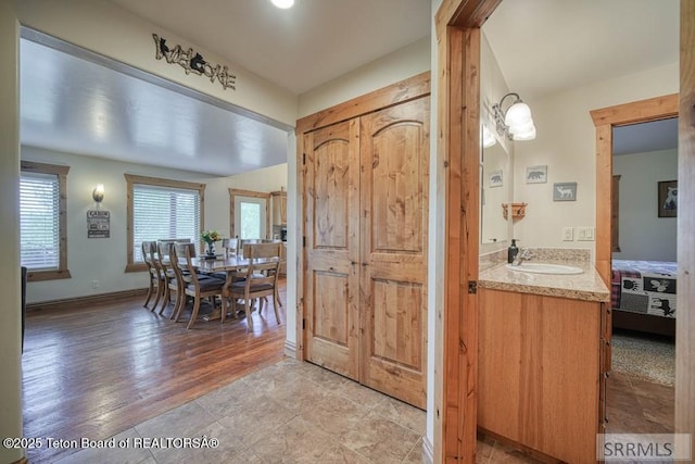 4770 Deer Dr, Island Park, ID 83429 - bathroom featuring vanity, wood finished floors, and baseboards