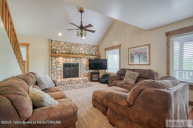 4770 Deer Dr, Island Park, ID 83429 - carpeted living room featuring ceiling fan, plenty of natural light, stairs, a fireplace, and recessed lighting