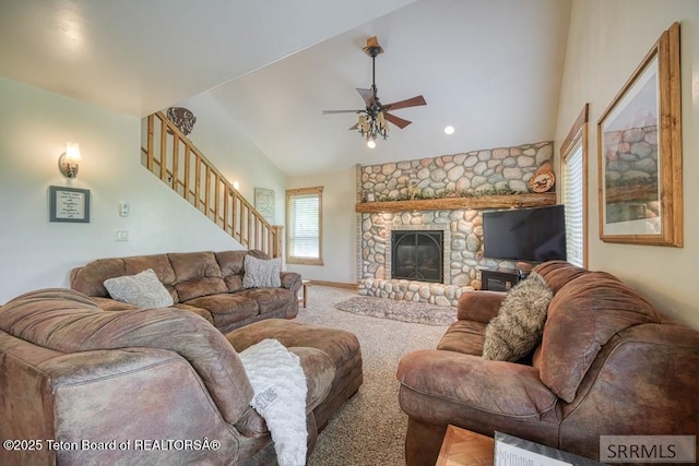 4770 Deer Dr, Island Park, ID 83429 - living area featuring ceiling fan, stairs, vaulted ceiling, carpet flooring, and a stone fireplace