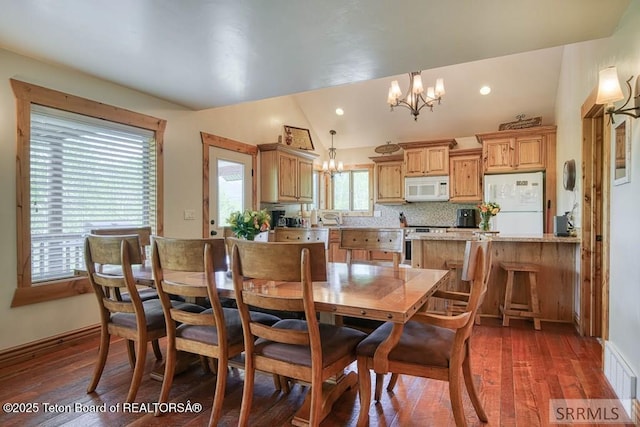 4770 Deer Dr, Island Park, ID 83429 - dining space featuring a chandelier, dark wood-style flooring, lofted ceiling, baseboards, and recessed lighting
