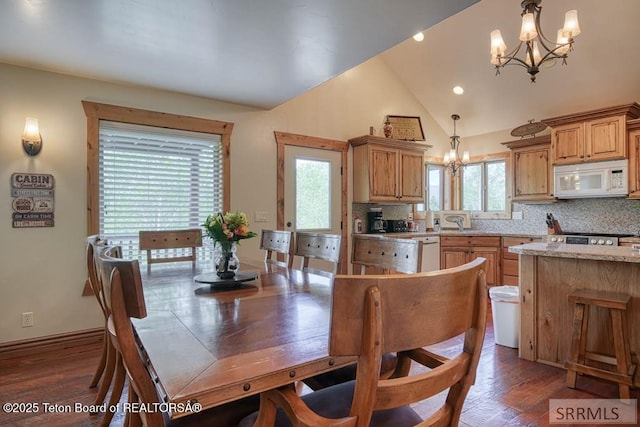 4770 Deer Dr, Island Park, ID 83429 - dining space with a chandelier, dark wood-style floors, recessed lighting, baseboards, and high vaulted ceiling