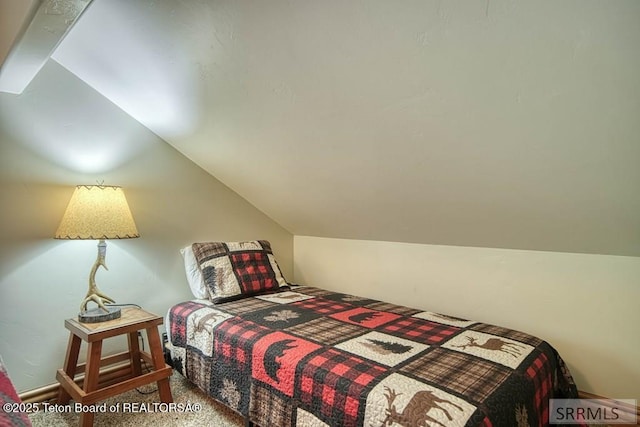 4770 Deer Dr, Island Park, ID 83429 - carpeted bedroom featuring lofted ceiling