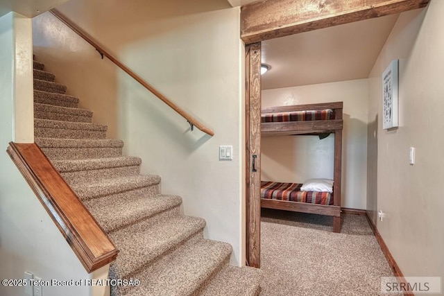 4770 Deer Dr, Island Park, ID 83429 - staircase with carpet floors and baseboards
