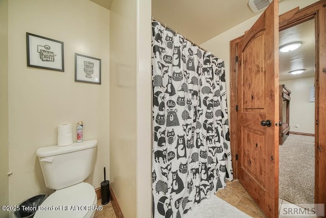 4770 Deer Dr, Island Park, ID 83429 - full bathroom featuring toilet and a shower with shower curtain