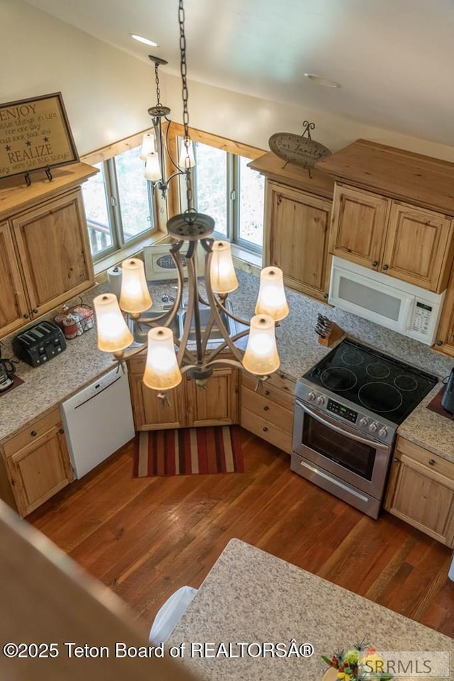 4770 Deer Dr, Island Park, ID 83429 - kitchen with white appliances, dark wood-type flooring, lofted ceiling, and pendant lighting