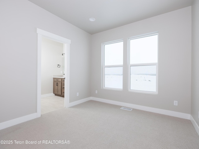 311 Bald Eagle Dr, Victor, ID 83455 - unfurnished room with light colored carpet and baseboards