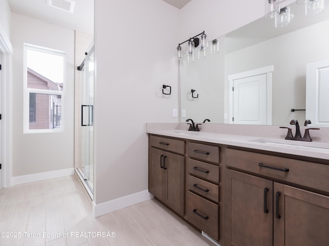 311 Bald Eagle Dr, Victor, ID 83455 - full bath featuring double vanity, a shower stall, and baseboards
