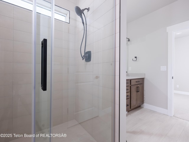 311 Bald Eagle Dr, Victor, ID 83455 - bathroom featuring a shower stall, vanity, and baseboards