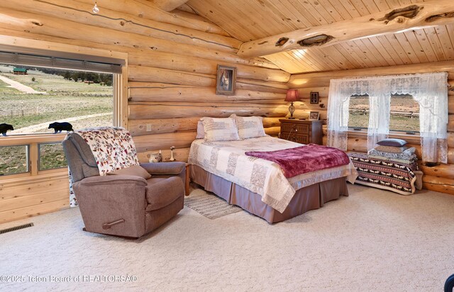 196 Soda Springs Dr, Dubois, WY 82513 - bedroom featuring wooden ceiling, rustic walls, multiple windows, and carpet