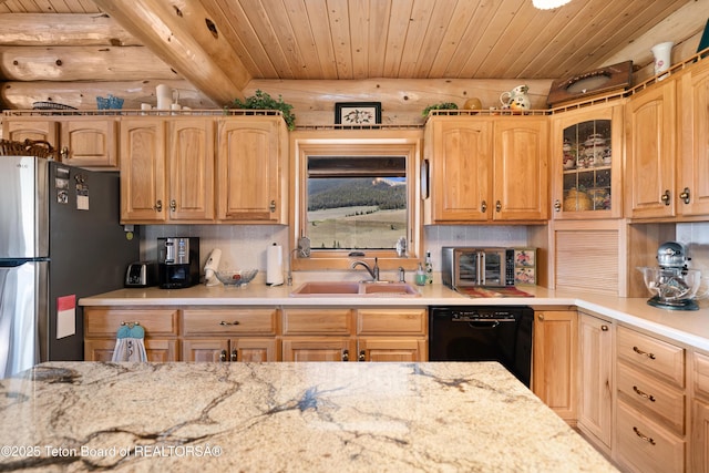 196 Soda Springs Dr, Dubois, WY 82513 - kitchen featuring black dishwasher, freestanding refrigerator, wooden ceiling, light stone counters, and decorative backsplash