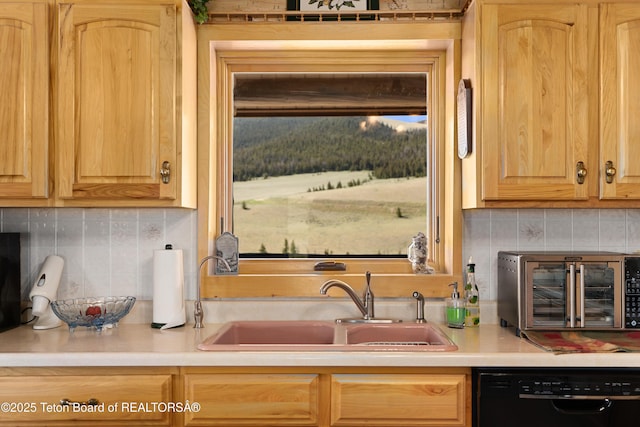 196 Soda Springs Dr, Dubois, WY 82513 - kitchen featuring black dishwasher, light brown cabinets, decorative backsplash, and light countertops