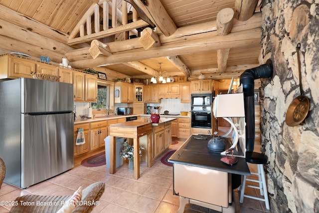 196 Soda Springs Dr, Dubois, WY 82513 - kitchen featuring black appliances, wood ceiling, light tile patterned flooring, a center island, and a chandelier