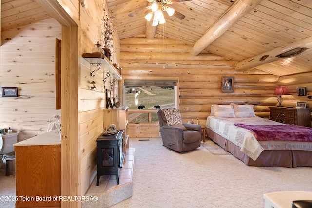 196 Soda Springs Dr, Dubois, WY 82513 - bedroom featuring wood ceiling, a wood stove, rustic walls, and carpet flooring