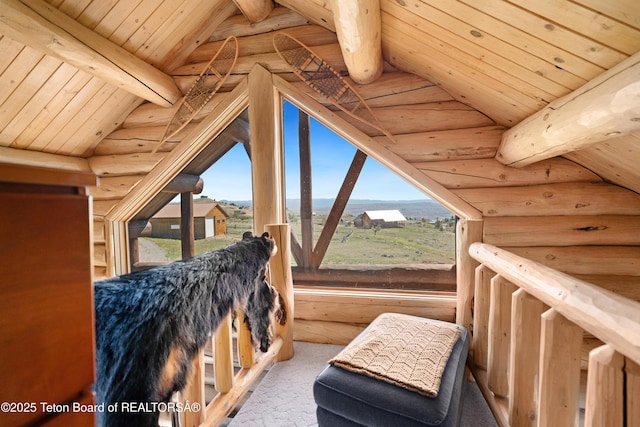 196 Soda Springs Dr, Dubois, WY 82513 - interior space with log walls, wood ceiling, and multiple windows