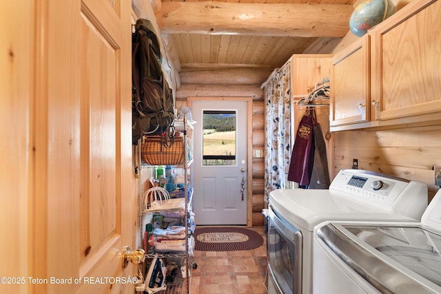 196 Soda Springs Dr, Dubois, WY 82513 - laundry area with log walls, cabinet space, washer and clothes dryer, and wood ceiling