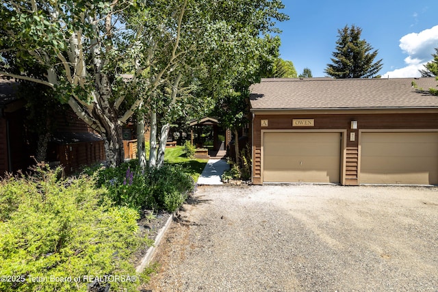 450 E Sagebrush Dr Unit 3-1-A, Jackson, WY 83001 - view of front of property with a shingled roof and driveway