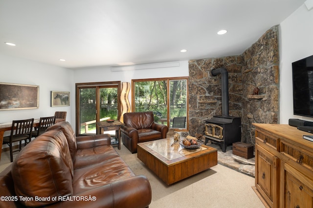450 E Sagebrush Dr Unit 3-1-A, Jackson, WY 83001 - living area featuring a wood stove, light colored carpet, and recessed lighting