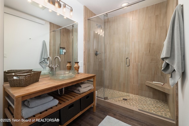 450 E Sagebrush Dr Unit 3-1-A, Jackson, WY 83001 - bathroom featuring vanity, a shower stall, and wood finished floors