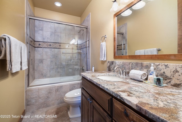 720 E Paintbrush Dr, Jackson, WY 83001 - full bath featuring toilet, vanity, tiled shower / bath combo, and tile patterned flooring