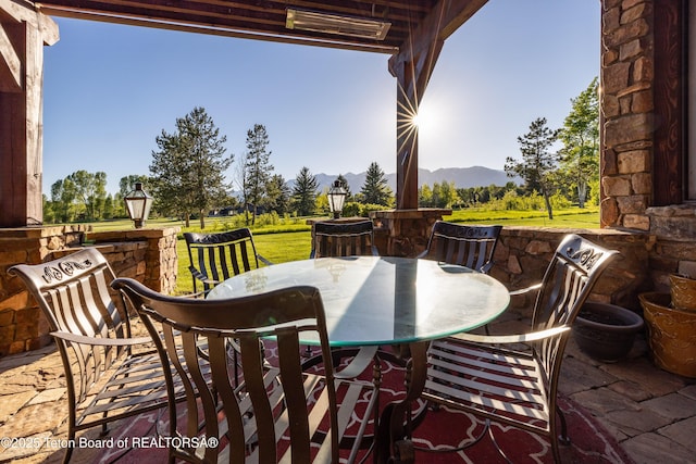 720 E Paintbrush Dr, Jackson, WY 83001 - view of patio / terrace featuring outdoor dining space and a mountain view