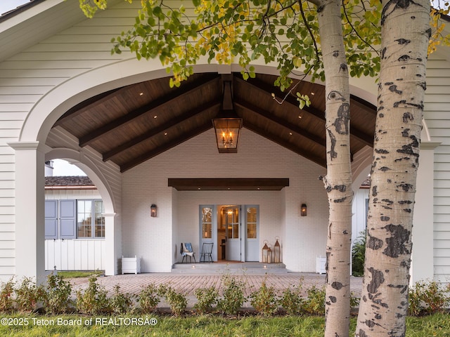 5025 Shoshone Dr, Wilson, WY 83014 - entrance to property with a porch and brick siding