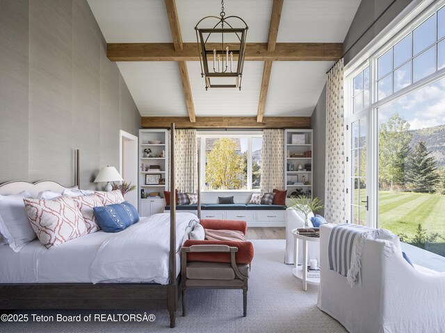 5025 Shoshone Dr, Wilson, WY 83014 - bedroom with multiple windows, beam ceiling, and high vaulted ceiling