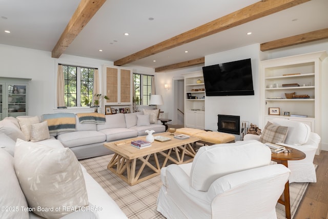 5025 Shoshone Dr, Wilson, WY 83014 - living room with light wood-style floors, a glass covered fireplace, recessed lighting, and beamed ceiling