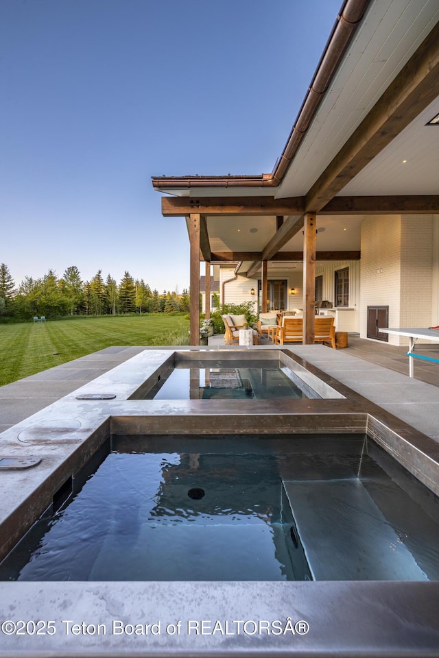 5025 Shoshone Dr, Wilson, WY 83014 - view of swimming pool with a yard and an in-ground hot tub