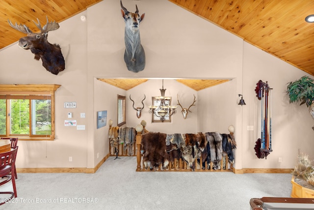 1255 Lost Crk, Thayne, WY 83127 - carpeted living area featuring wooden ceiling, a chandelier, baseboards, and high vaulted ceiling