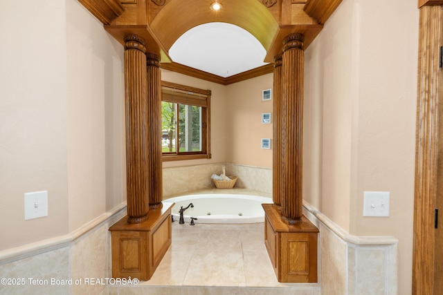 1255 Lost Crk, Thayne, WY 83127 - full bath with decorative columns, a whirlpool tub, ornamental molding, and tile patterned floors