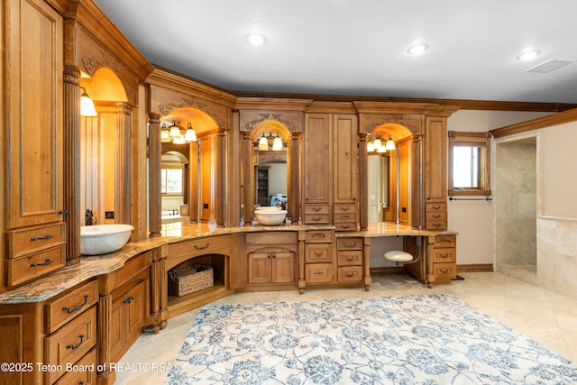 1255 Lost Crk, Thayne, WY 83127 - full bath with vanity, healthy amount of natural light, ornamental molding, decorative columns, and recessed lighting