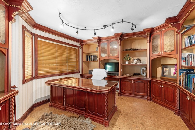 1255 Lost Crk, Thayne, WY 83127 - office with built in shelves, wallpapered walls, and a textured ceiling