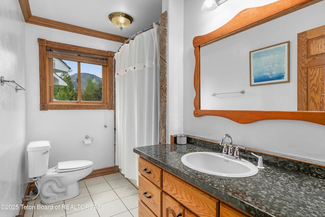 1255 Lost Crk, Thayne, WY 83127 - full bath featuring vanity, toilet, tile patterned flooring, and baseboards