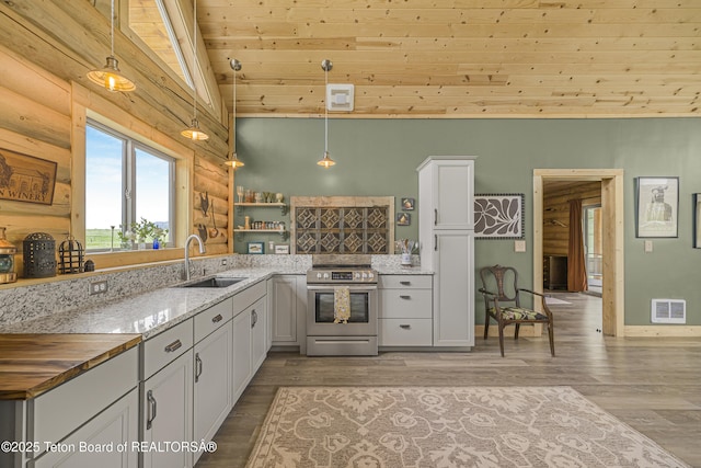 105 Elk Path, Swan Valley, ID 83428 - kitchen with stainless steel electric stove, a sink, vaulted ceiling, wood ceiling, and white cabinets