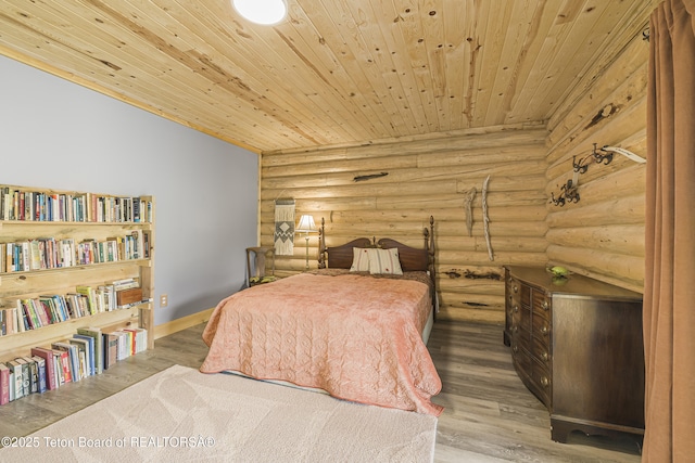 105 Elk Path, Swan Valley, ID 83428 - bedroom featuring wooden ceiling, rustic walls, wood finished floors, and baseboards