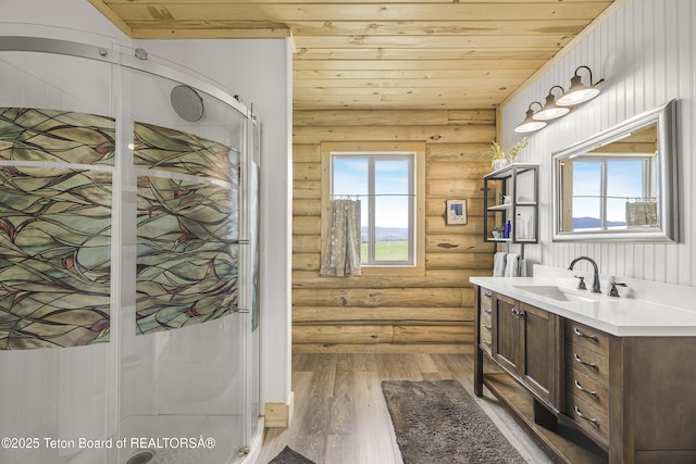 105 Elk Path, Swan Valley, ID 83428 - full bath with rustic walls, a shower stall, vanity, wood finished floors, and wooden ceiling