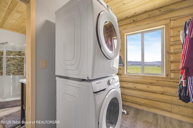 105 Elk Path, Swan Valley, ID 83428 - washroom featuring stacked washer / drying machine, rustic walls, wood finished floors, and wood ceiling