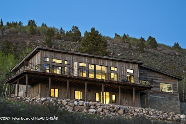 5170 Meandering Moose Dr, Victor, ID 83455 - rear view of property featuring a deck and board and batten siding