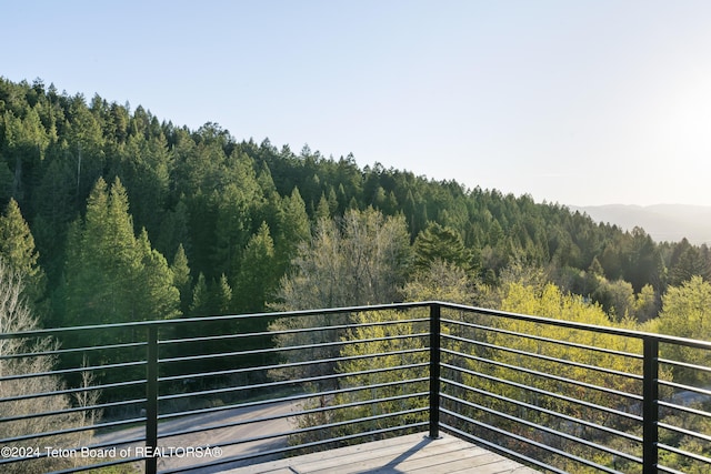 5170 Meandering Moose Dr, Victor, ID 83455 - balcony featuring a forest view