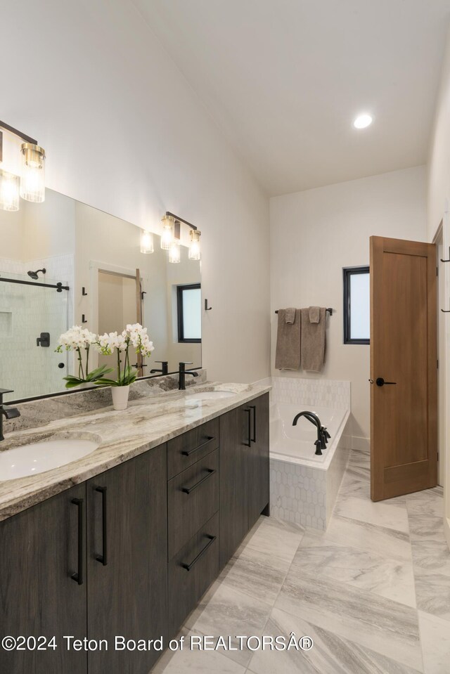5170 Meandering Moose Dr, Victor, ID 83455 - full bathroom featuring a garden tub, double vanity, a shower stall, and lofted ceiling