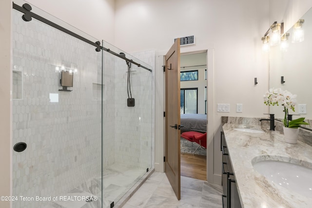 5170 Meandering Moose Dr, Victor, ID 83455 - bathroom with double vanity, a shower stall, marble look tiles, and ensuite bathroom