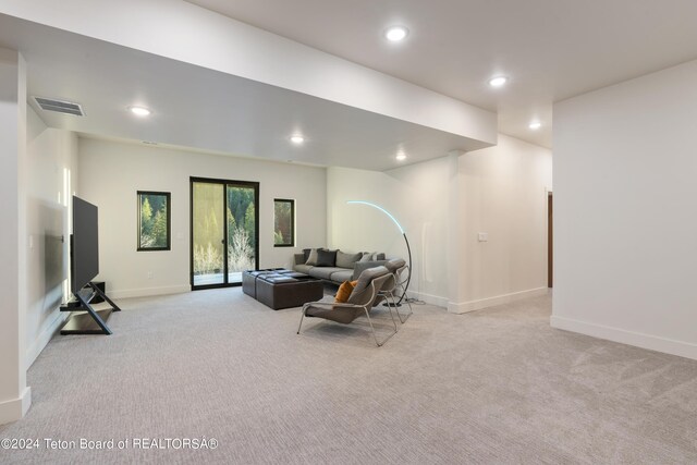 5170 Meandering Moose Dr, Victor, ID 83455 - living area featuring light carpet, recessed lighting, and baseboards