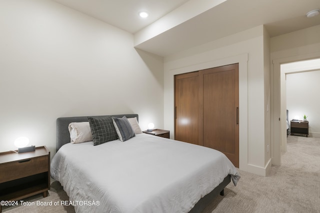 5170 Meandering Moose Dr, Victor, ID 83455 - carpeted bedroom featuring a closet, baseboards, and recessed lighting