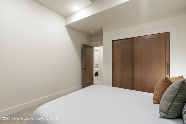 5170 Meandering Moose Dr, Victor, ID 83455 - bedroom with baseboards, a closet, and carpet