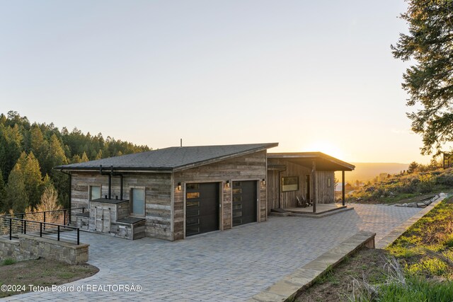 5170 Meandering Moose Dr, Victor, ID 83455 - view of front of home featuring a garage and driveway