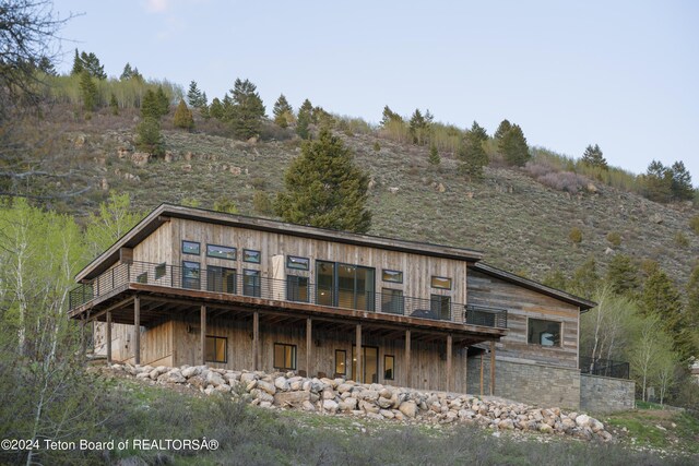 5170 Meandering Moose Dr, Victor, ID 83455 - back of house with a wooden deck