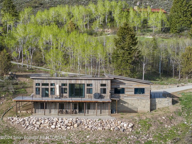 5170 Meandering Moose Dr, Victor, ID 83455 - back of property with a deck